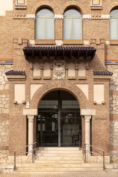 Malaga, Spain- 26-01-2024: Entrance of Universidad de Malaga with traditional brickwork, perfect for educational themes or Spanish architecture. The University of Malaga