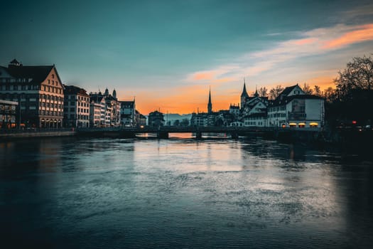 View of the River Limmat and the old town of Zurich shortly after sunset . High quality photo