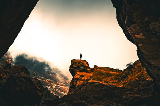 A person enjoying the view of the volcanic rocks of Grand Canaria. High quality photo