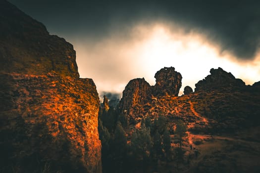 Roque Nublo - volcanic rock on Gran Canria illuminated by the sun through a fog hole. High quality photo