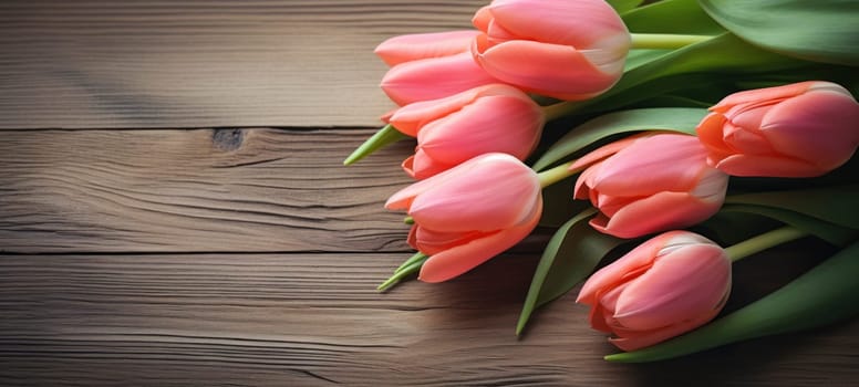 A bouquet of pink tulips arranged elegantly on a polished wooden surface, emphasizing contrast and natural beauty.