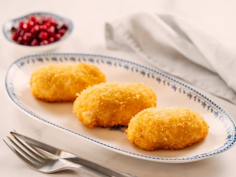 Crispy breaded cutlet. Three perfect crunchy cutlet on plate. Delicious fried cutlets in bread crumbs made from beef, pork, chicken meat or fish