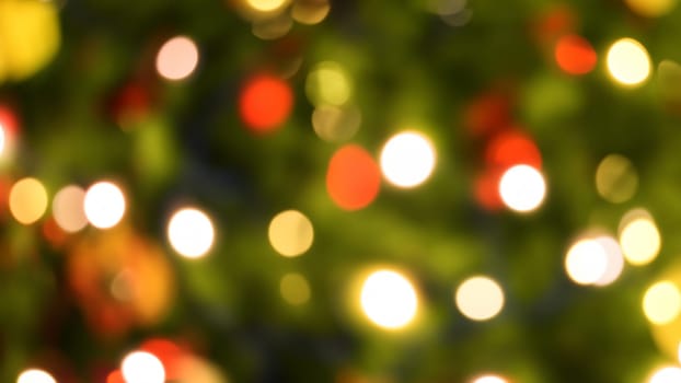 Defocused christmas tree lights and decorations bokeh background. Abstract Christmas background.