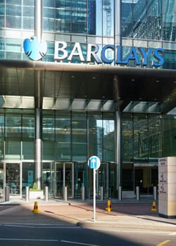 London, United Kingdom - February 03, 2019: Blue Barclays logo at their worldwide headquarters in Canary Wharf. It is British multinational investment bank, one of largest world banks.