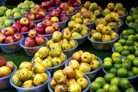 London, United Kingdom - February 04, 2019: Typical food market at Lewisham, fruit is usually sold in plastic bowls, with same price tag, sellers attracting customers with famous "pound a bowl" shout.