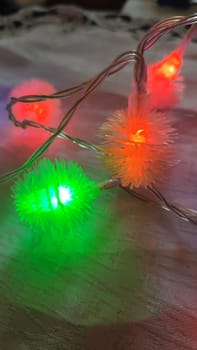 green light red color, light bulbs garlands, holiday objects. High quality photo