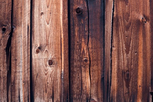 Background with old wooden boards, vintage dark shade, textured and scratched, woody house wall or floor.