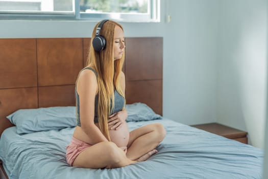 Expectant woman finds serenity in pregnancy, listening to affirmations and meditating for calmness.