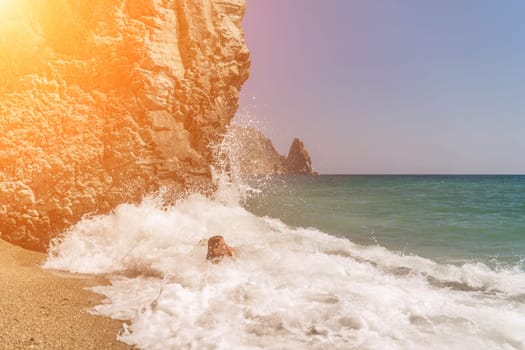 Women ocean play. Seaside, beach daytime, enjoying beach fun. Two women in red swimsuits enjoying themselves in the ocean waves