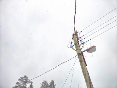 Old pole with wires against the sky. Electric transmission line, Eco-friendly energy