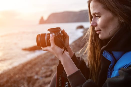 Woman travel sea. Happy tourist taking picture outdoors for memories. Woman traveler looks at the edge of the cliff on the sea bay of mountains, sharing travel adventure journey.