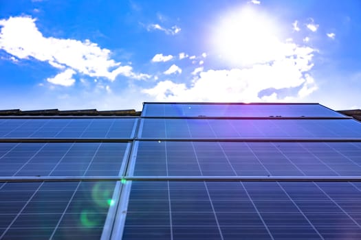 Intense solar radiation on solar panels of a solar system on a private rooftop, Germany