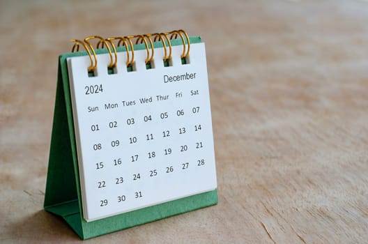 December 2024 table calendar with customizable space for text. Calendar and copy space concepts.