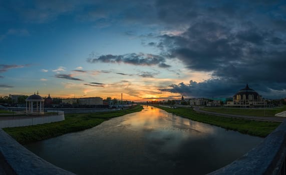 Summer sundown in Tula, Russia. Wide angle panoramic view from bridge over Upa river. Photo taken in may 2016.