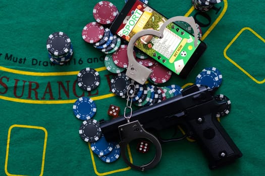 Illegal gambling concept handgun with betting chips