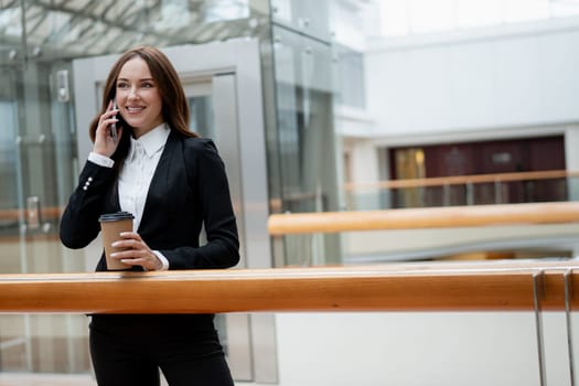 Smiling businesswoman in the office. High quality photo