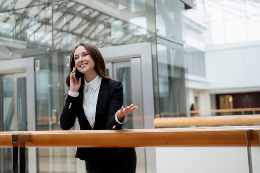 Smiling businesswoman in the office. High quality photo