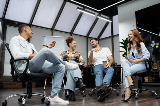 Group of diverse businesspeople working together in a modern workspace.