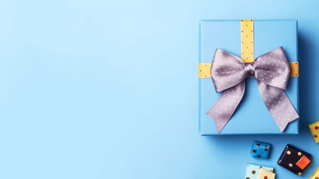 Celebrate Fathers Day in style with a gift box, necktie, and glasses elegantly arranged on a pastel blue background. A tasteful flat lay capturing the essence of appreciation.