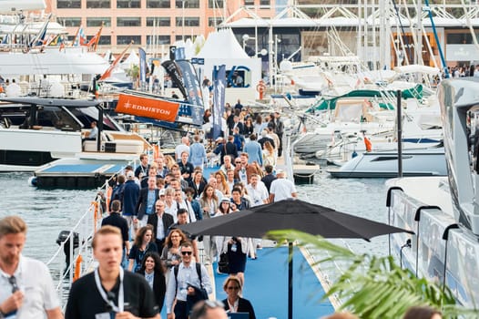 Monaco, Monte Carlo, 29 September 2022 - The famous motorboat exhibition, mega yacht show, clients and yacht brokers discuss the novelties of the boating industry, look at the mega yachts presented. High quality photo