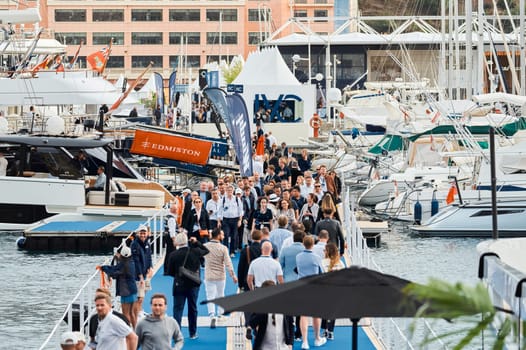 Monaco, Monte Carlo, 29 September 2022 - The famous motorboat exhibition, mega yacht show, clients and yacht brokers discuss the novelties of the boating industry, look at the mega yachts presented. High quality photo