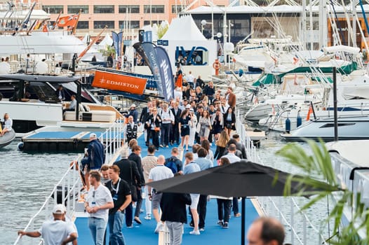 Monaco, Monte Carlo, 29 September 2022 - The famous motorboat exhibition, mega yacht show, clients and yacht brokers discuss the novelties of the boating industry, look at the mega yachts presented. High quality photo