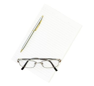 Eyeglasses and notepad on white background