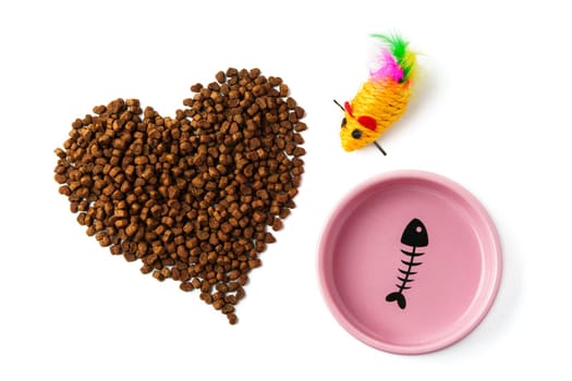 Bowl with dry pet food isolated on white background close up