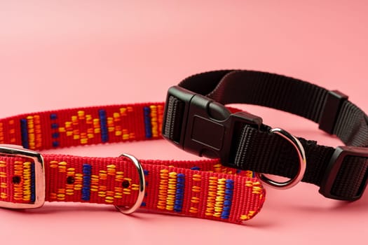 Textile pet collar on pink background studio photo close up