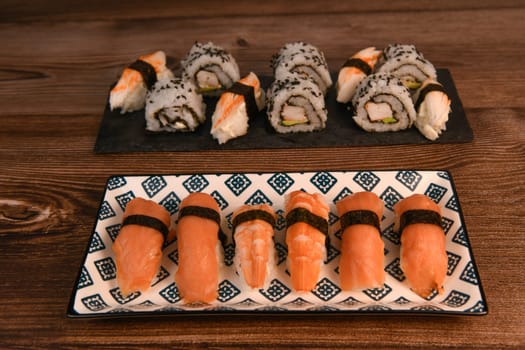 japanese sushi food. Maki ands rolls with tuna, salmon, shrimp, crab and avocado, High quality photo