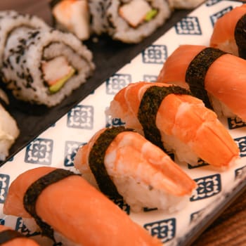 japanese sushi food. Maki ands rolls with tuna, salmon, shrimp, crab and avocado, High quality photo