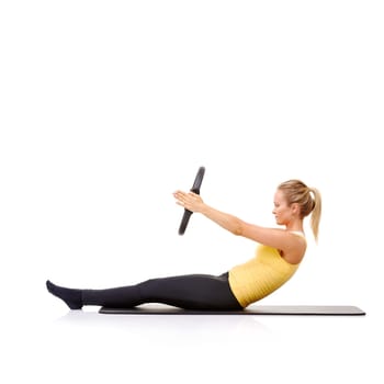 Woman, pilates ring and arms for balance stretching on yoga mat or resistance health, roll up or studio white background. Female person, equipment for muscle flexibility, wellness strength or mockup.