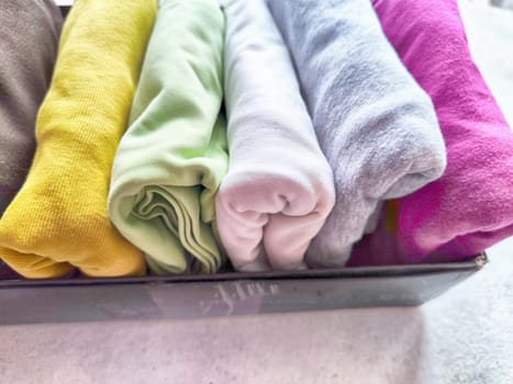 Tidy and organized clothes with the konmari method. Storage of T-shirts folded in box