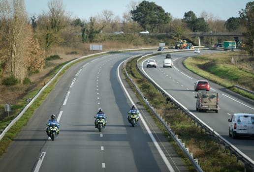 France, Bordeaux, 29 January 2024, Farmers' demonstration, mobile gendarmes on their motorbikes securing a demonstration by French farmers on a motorway in south-west France. High quality 4k footage