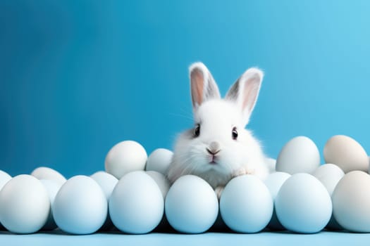 Cute white bunny with Easter eggs on blue background with copy space. ai generated