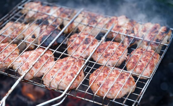 Closeup of fried meat cutlets on wire rack. Rustic cuisine concept