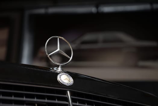 Antalya, Turkey - January 31, 2024: Original Mercedes-Benz E-Class logo standing on the front grille