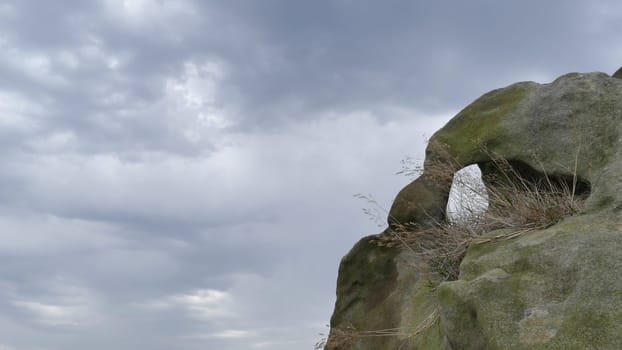 Beautiful rock with the clouds in the background