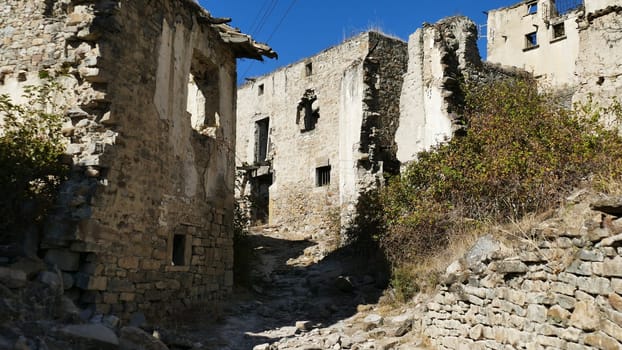 Street of an uninhabited village in the ruins of Yesa in Navarra