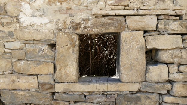 Window in an uninhabited village in the ruins of Yesa in Navarre