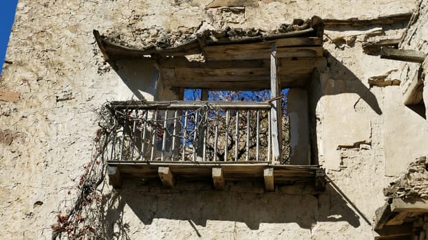 Balcony in an uninhabited village in the ruins of Yesa in Navarre