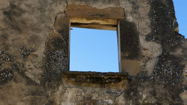 Window in an uninhabited village in the ruins of Yesa in Navarre