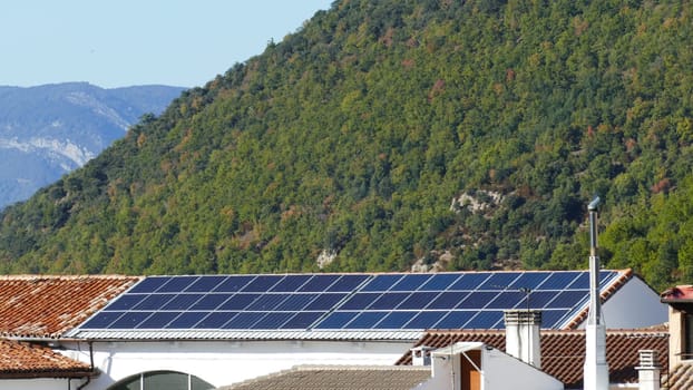 Building with solar panels on the roof of a village of Yesa in Navarre