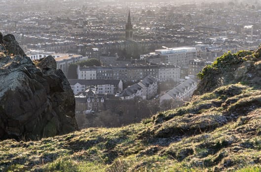 Edinburgh, Scotland - Jan 17, 2024 - Amazing Edinburgh Cityscape and Edinburgh Castle seen from the top of Salisbury Crags. Destinations in Europe, Copy space, Selective focus.