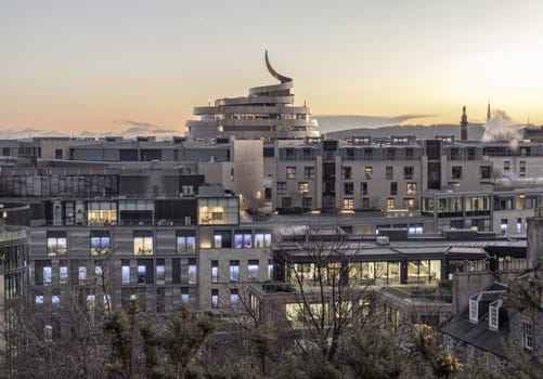 Edinburgh, Scotland - Jan 17, 2024 - Aerial view of St James Quarter shopping centre at sunset in Edinburgh from The hilltop of Calton Hill in central Edinburgh. Modern city architecture, Destinations in Europe, Space for text, Selective focus.