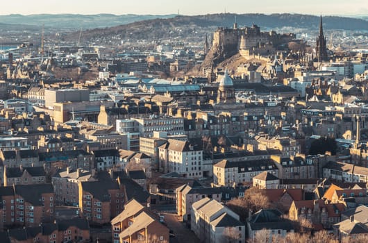 Edinburgh, Scotland - Jan 17, 2024 - Amazing Edinburgh Cityscape and Edinburgh Castle seen from the top of Salisbury Crags. Destinations in Europe, Copy space, Selective focus.