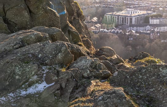 Edinburgh, Scotland - Jan 17, 2024 - Amazing Edinburgh Cityscape seen from the top of Salisbury Crags. Destinations in Europe, Space for text, Selective focus.