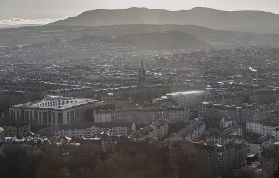 Edinburgh, Scotland - Jan 17, 2024 - Amazing Edinburgh Cityscape and Edinburgh Castle seen from the top of Salisbury Crags. Destinations in Europe, Copy space, Selective focus.
