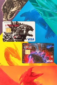 tokyo, japan - jan 27 2024: Newest Japanese Visa EPOS credit cards featuring illustrations of Godzilla, the mascot of Toho Cinemas, as well as depictions of King Ghidorah, Mothra, Rodan and Gamera.