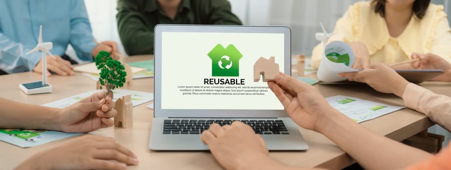 Reusable sign displayed on green business laptop while business team presenting green design to customer. ESG environment social governance and Eco conservative concept. Closeup. Delineation